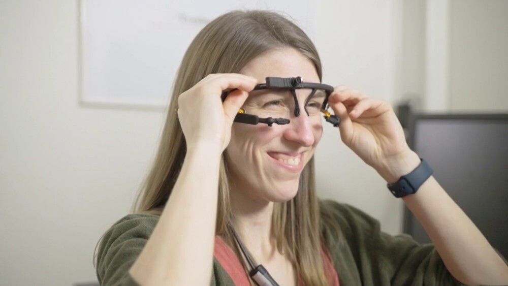 Person putting on eye tracking glasses